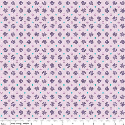 Image of Celtic Cats Paws Lilac quilting cotton fabric by Brigid Ashwood for Riley Blake Designs. Features pawprints on a purple background. Cute Little Fabric Shop