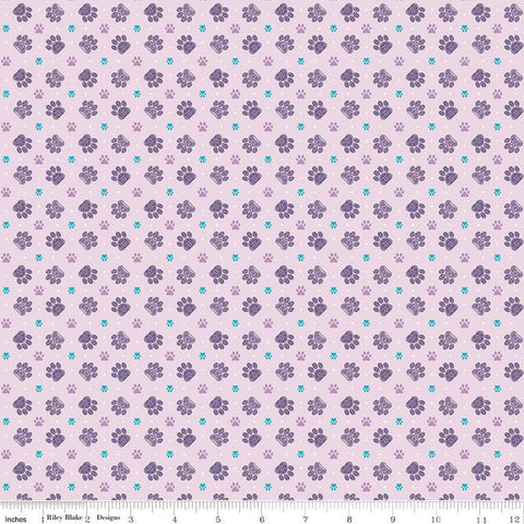Image of Celtic Cats Paws Lilac quilting cotton fabric by Brigid Ashwood for Riley Blake Designs. Features pawprints on a purple background. Cute Little Fabric Shop