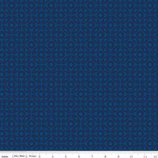 Image of Celtic Cats Circle Paws Navy quilting cotton fabric by Brigid Ashwood for Riley Blake Designs. Features pawprints on a blue background. Cute Little Fabric Shop