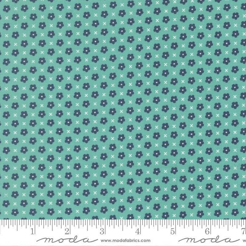 Image of Delightfully Yours Blooms Poolside quilting cotton fabric by Sherri & Chelsi for Moda Fabrics. Features flowers on a blue background. Cute Little Fabric Shop