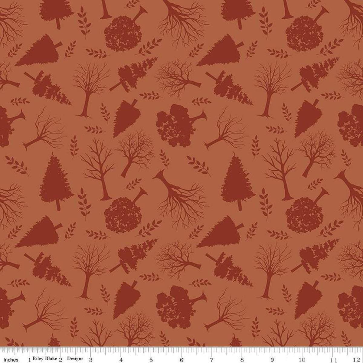 Image of Flannel Into the Woods Trees Rust flannel cotton fabric by Diane Labombarbe for Riley Blake Designs. Features plants on an orange background. Cute Little Fabric Shop