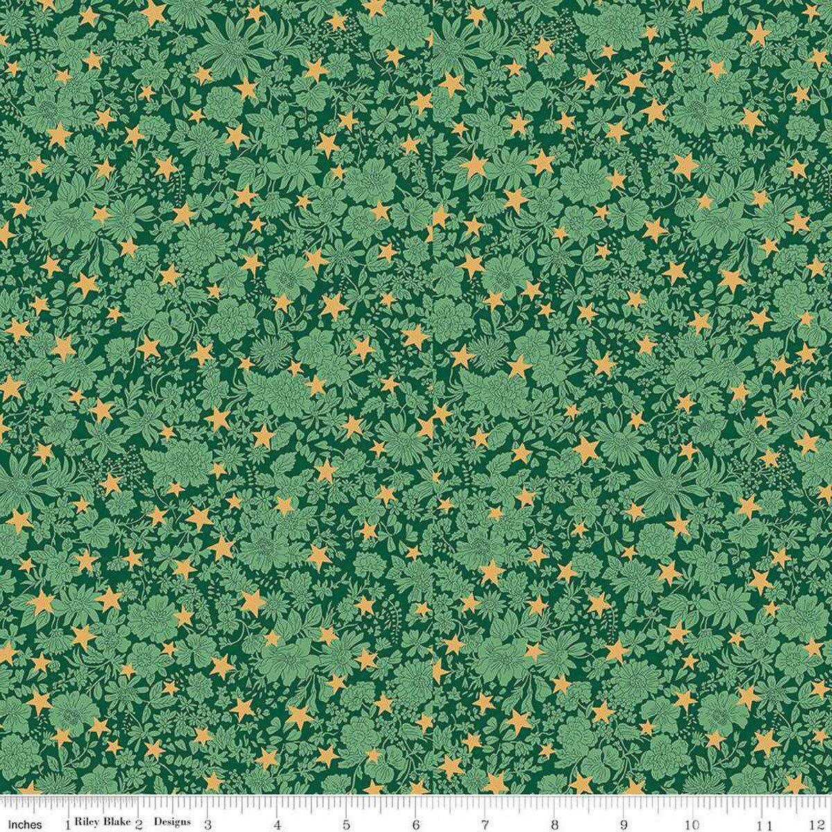 Image of Festive Greetings Emily Star quilting cotton fabric by Liberty Fabrics for Riley Blake Designs. Features stars on a green background. Cute Little Fabric Shop
