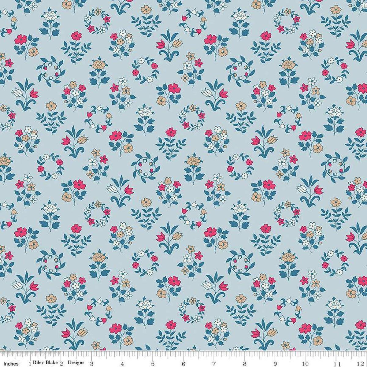 Image of Craft Garden Mary's Embroidery quilting cotton fabric by Liberty Fabrics for Riley Blake Designs. Features flowers on a blue background. Cute Little Fabric Shop