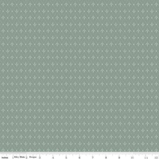 Image of Threads of Grace Ivy Dream quilting cotton fabric by Kassidy Grace for Riley Blake Designs. Features leaves on a blue background. Cute Little Fabric Shop