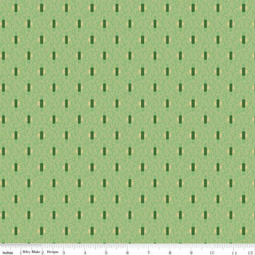 Image of Vera's Garden Dashes Green quilting cotton fabric by Vicki McCarty for Riley Blake Designs. Features shapes on a green background. Cute Little Fabric Shop