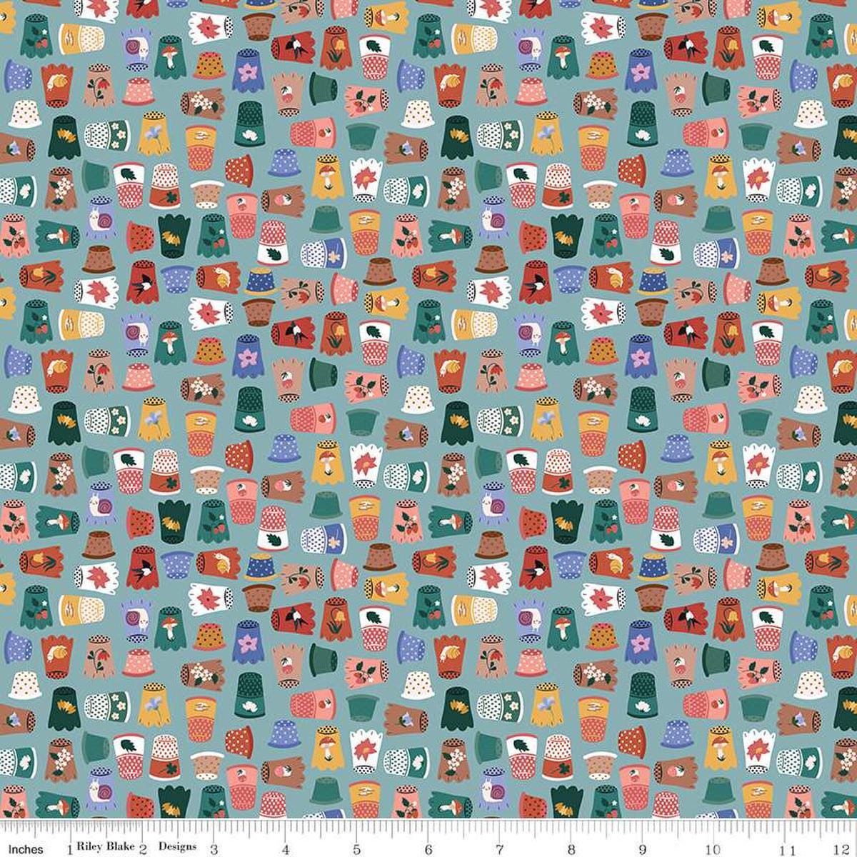 Image of Thimbelina & The Sewing Fairies Thimble Collection Mist quilting cotton fabric by Jennifer Long for Riley Blake Designs. Features thimbles on a blue background. Cute Little Fabric Shop