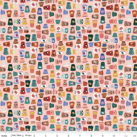 Image of Thimbelina & The Sewing Fairies Thimble Collection Apricot Mist quilting cotton fabric by Jennifer Long for Riley Blake Designs. Features thimbles on a pink background. Cute Little Fabric Shop