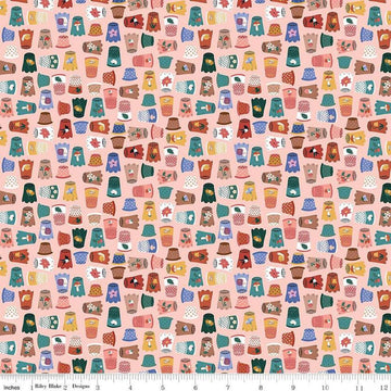 Image of Thimbelina & The Sewing Fairies Thimble Collection Apricot Mist quilting cotton fabric by Jennifer Long for Riley Blake Designs. Features thimbles on a pink background. Cute Little Fabric Shop