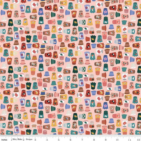 Image of Thimbelina & The Sewing Fairies Thimble Collection Apricot Mist quilting cotton fabric by Jennifer Long for Riley Blake Designs. Features thimbles on a pink background. Cute Little Fabric Shop