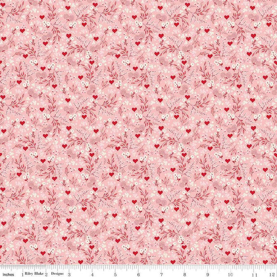 Image of Letters to Cupid Ditsy Floral Pink quilting cotton fabric by My Mind's Eye for Riley Blake Designs. Features flowers on a pink background. Cute Little Fabric Shop