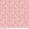 Image of Letters to Cupid Ditsy Floral Pink quilting cotton fabric by My Mind's Eye for Riley Blake Designs. Features flowers on a pink background. Cute Little Fabric Shop