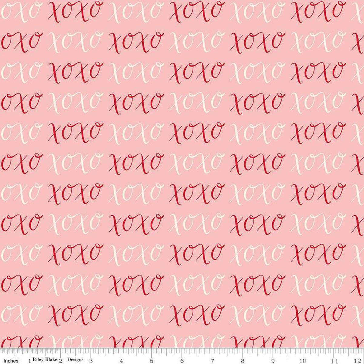 Image of Letters to Cupid XOXO Pink quilting cotton fabric by My Mind's Eye for Riley Blake Designs. Features writing on a pink background. Cute Little Fabric Shop