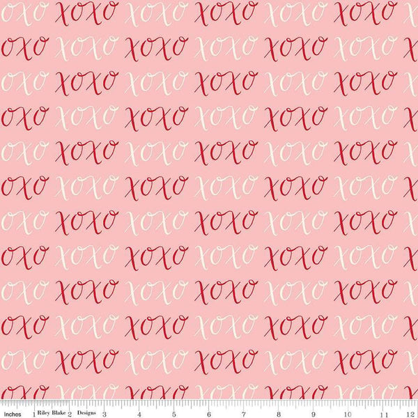 Image of Letters to Cupid XOXO Pink quilting cotton fabric by My Mind&#39;s Eye for Riley Blake Designs. Features writing on a pink background. Cute Little Fabric Shop