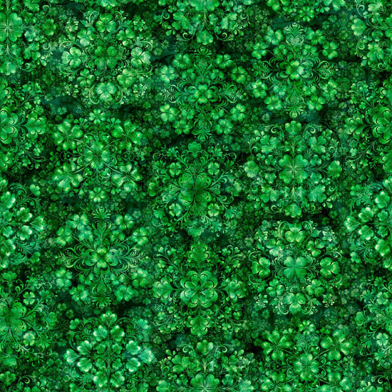 Image of Spirit of Ireland Shamrock Clusters Green quilting cotton fabric by Morris Creative Group for QT Fabrics. Features clovers on a green background. Cute Little Fabric Shop