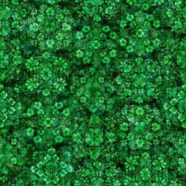 Image of Spirit of Ireland Shamrock Clusters Green quilting cotton fabric by Morris Creative Group for QT Fabrics. Features clovers on a green background. Cute Little Fabric Shop