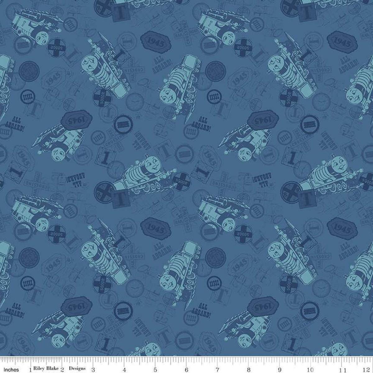 Image of Thomas & Friends™ 80th Anniversary Tonal Toss Denim quilting cotton fabric by Riley Blake Official Licensed Product for Riley Blake Designs. Features train signs on a blue background. Cute Little Fabric Shop