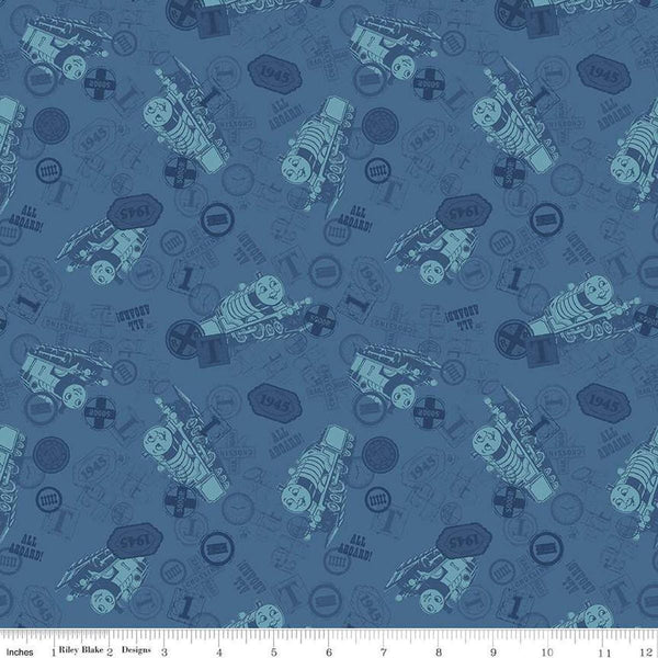 Image of Thomas & Friends™ 80th Anniversary Tonal Toss Denim quilting cotton fabric by Riley Blake Official Licensed Product for Riley Blake Designs. Features train signs on a blue background. Cute Little Fabric Shop
