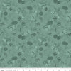 Image of Thomas & Friends™ 80th Anniversary Tonal Toss Green quilting cotton fabric by Riley Blake Official Licensed Product for Riley Blake Designs. Features train signs on a green background. Cute Little Fabric Shop