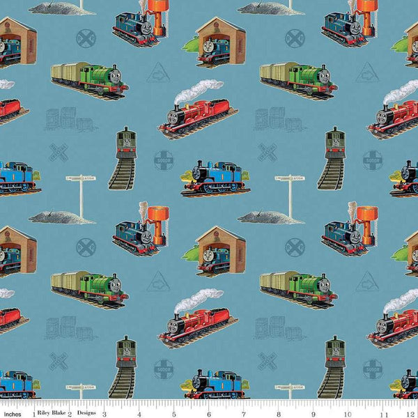 Image of Thomas & Friends™ 80th Anniversary Main Blue quilting cotton fabric by Riley Blake Official Licensed Product for Riley Blake Designs. Features trains on a blue background. Cute Little Fabric Shop