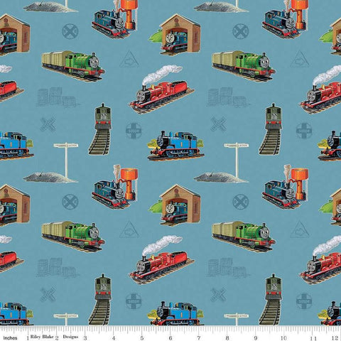 Image of Thomas & Friends™ 80th Anniversary Main Blue quilting cotton fabric by Riley Blake Official Licensed Product for Riley Blake Designs. Features trains on a blue background. Cute Little Fabric Shop