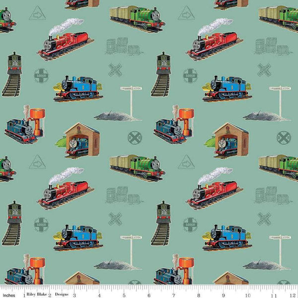 Image of Thomas & Friends™ 80th Anniversary Main Green quilting cotton fabric by Riley Blake Official Licensed Product for Riley Blake Designs. Features trains on a green background. Cute Little Fabric Shop