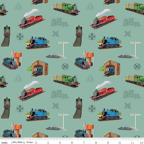 Image of Thomas & Friends™ 80th Anniversary Main Green quilting cotton fabric by Riley Blake Official Licensed Product for Riley Blake Designs. Features trains on a green background. Cute Little Fabric Shop