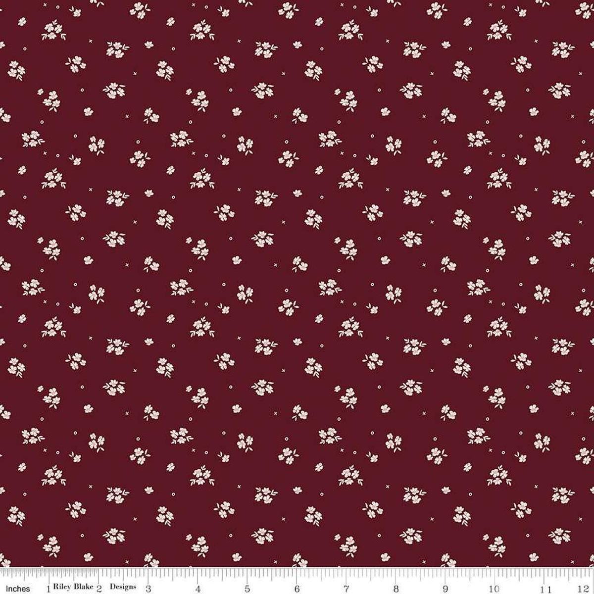 Image of Love You Always Ditsy Maroon quilting cotton fabric by Sandy Gervais for Riley Blake Designs. Features flowers on a red background. Cute Little Fabric Shop