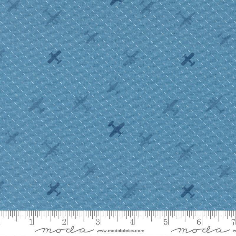 Image of High Flight Airplanes Lake quilting cotton fabric by Sariditty for Moda Fabric. Features airplanes on a blue background. Cute Little Fabric Shop