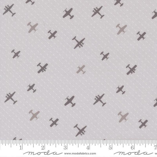 Image of High Flight Airplanes Smoke quilting cotton fabric by Sariditty for Moda Fabric. Features airplanes on a gray background. Cute Little Fabric Shop