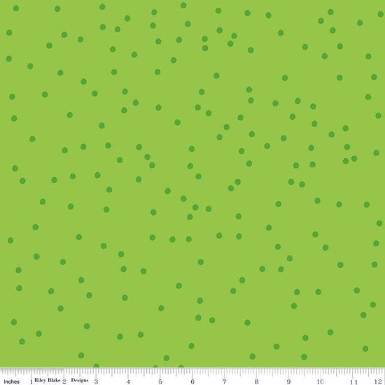 Image of On The Dot Kiwi quilting cotton fabric by Sew Yeah Quilting for Riley Blake Designs. Features dots on a green background. Cute Little Fabric Shop