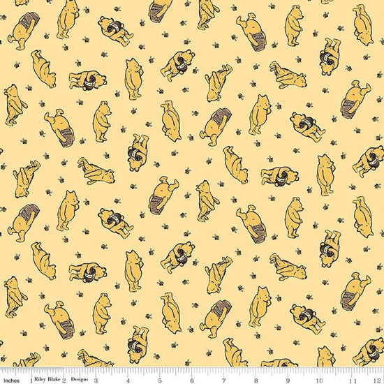 Image of Winnie the Pooh Toss Sunshine quilting cotton fabric by Echo Park Paper Co for Riley Blake Designs. Features Pooh on a yellow background. Cute Little Fabric Shop