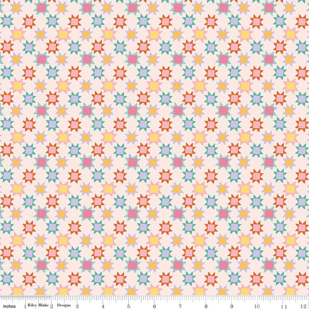 Image of Patchwork Stars Latte quilting cotton fabric by Liza Taylor for Riley Blake Designs. Features stars on a cream background. Cute Little Fabric Shop