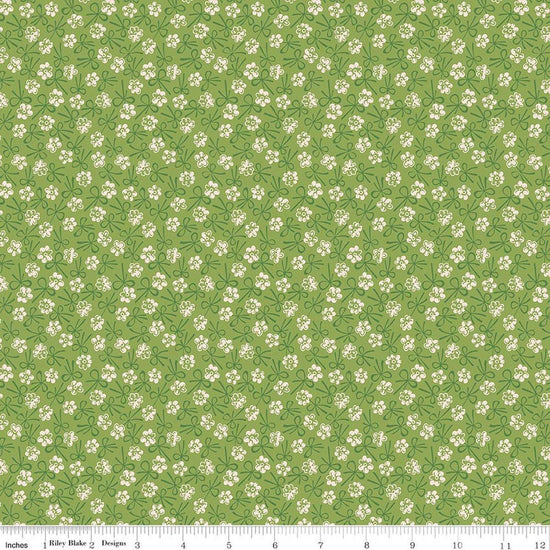 Image of Farmer's Daughter Bonnet Thyme quilting cotton fabric by Lori Holt for Riley Blake Designs. Features flowers on a green background. Cute Little Fabric Shop