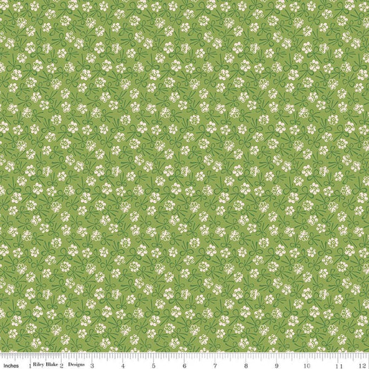 Image of Farmer's Daughter Bonnet Thyme quilting cotton fabric by Lori Holt for Riley Blake Designs. Features flowers on a green background. Cute Little Fabric Shop