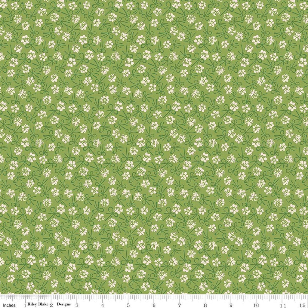Image of Farmer's Daughter Bonnet Thyme quilting cotton fabric by Lori Holt for Riley Blake Designs. Features flowers on a green background. Cute Little Fabric Shop