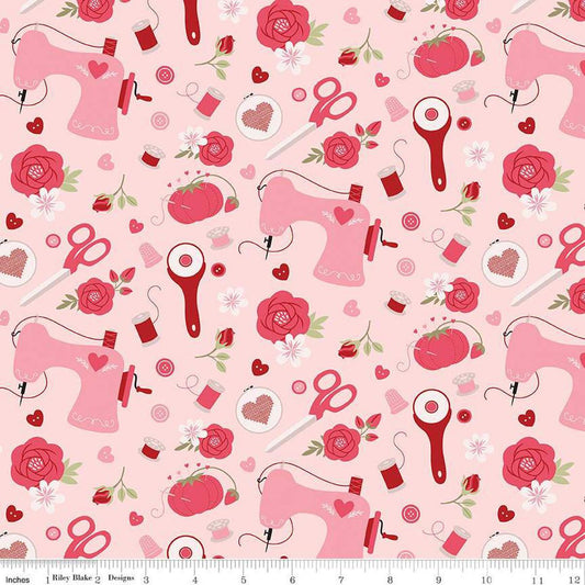 Image of Sew In Love Sewing Blush quilting cotton fabric by Dan Mogstad for Riley Blake Designs. Features sewing supplies on a pink background. Cute Little Fabric Shop