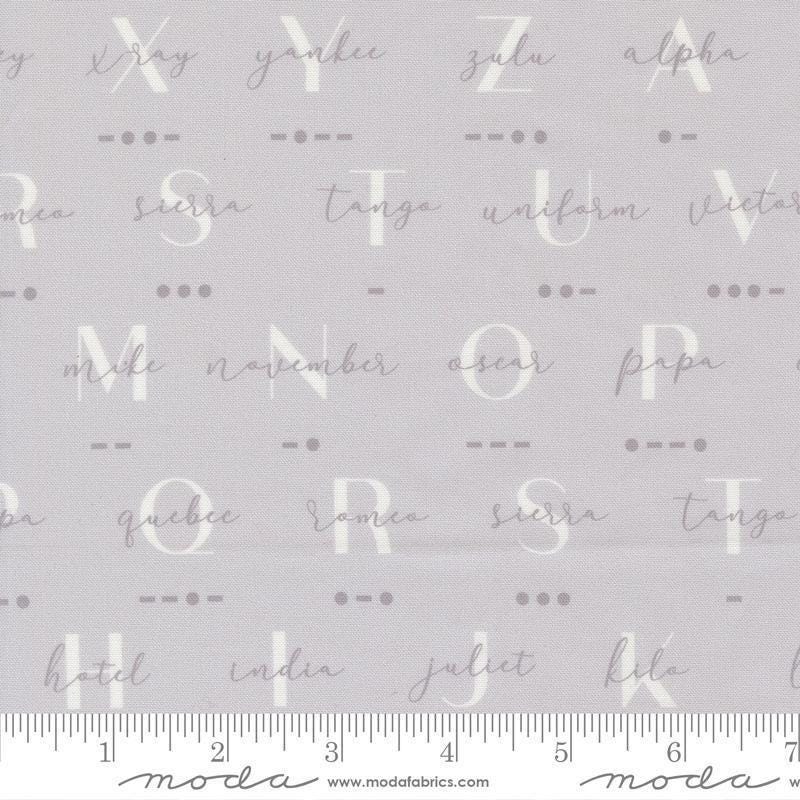 Image of High Flight Morse Smoke quilting cotton fabric by Sariditty for Moda Fabric. Features text on a gray background. Cute Little Fabric Shop