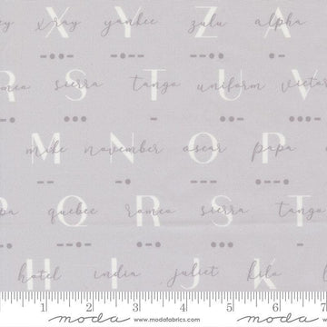 Image of High Flight Morse Smoke quilting cotton fabric by Sariditty for Moda Fabric. Features text on a gray background. Cute Little Fabric Shop