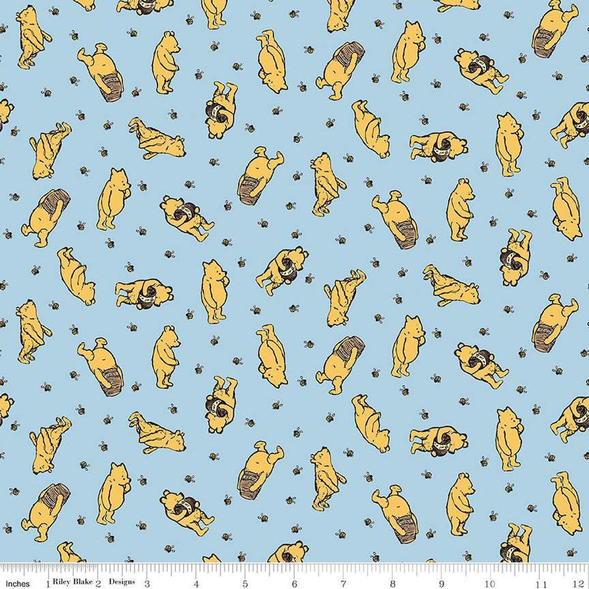 Image of Winnie the Pooh Toss Blue quilting cotton fabric by Echo Park Paper Co for Riley Blake Designs. Features Pooh on a blue background. Cute Little Fabric Shop