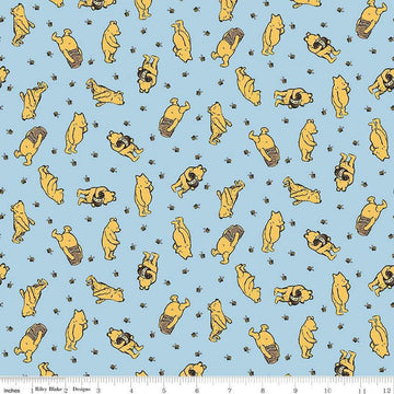 Image of Winnie the Pooh Toss Blue quilting cotton fabric by Echo Park Paper Co for Riley Blake Designs. Features Pooh on a blue background. Cute Little Fabric Shop