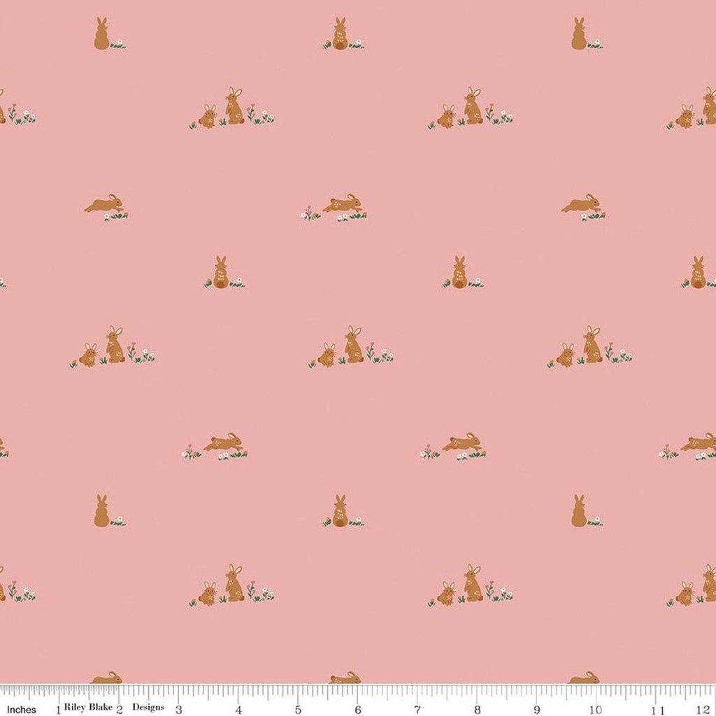 Image of Sweet Cotton Tales Flopsy Field Pink quilting cotton fabric by Cayla Naylor for Riley Blake Designs. Features rabbits on a pink background. Cute Little Fabric Shop