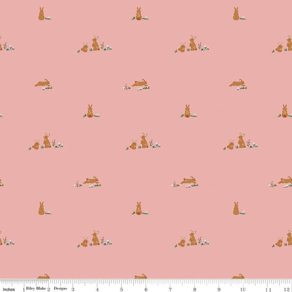 Image of Sweet Cotton Tales Flopsy Field Pink quilting cotton fabric by Cayla Naylor for Riley Blake Designs. Features rabbits on a pink background. Cute Little Fabric Shop