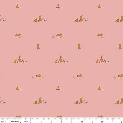 Image of Sweet Cotton Tales Flopsy Field Pink quilting cotton fabric by Cayla Naylor for Riley Blake Designs. Features rabbits on a pink background. Cute Little Fabric Shop