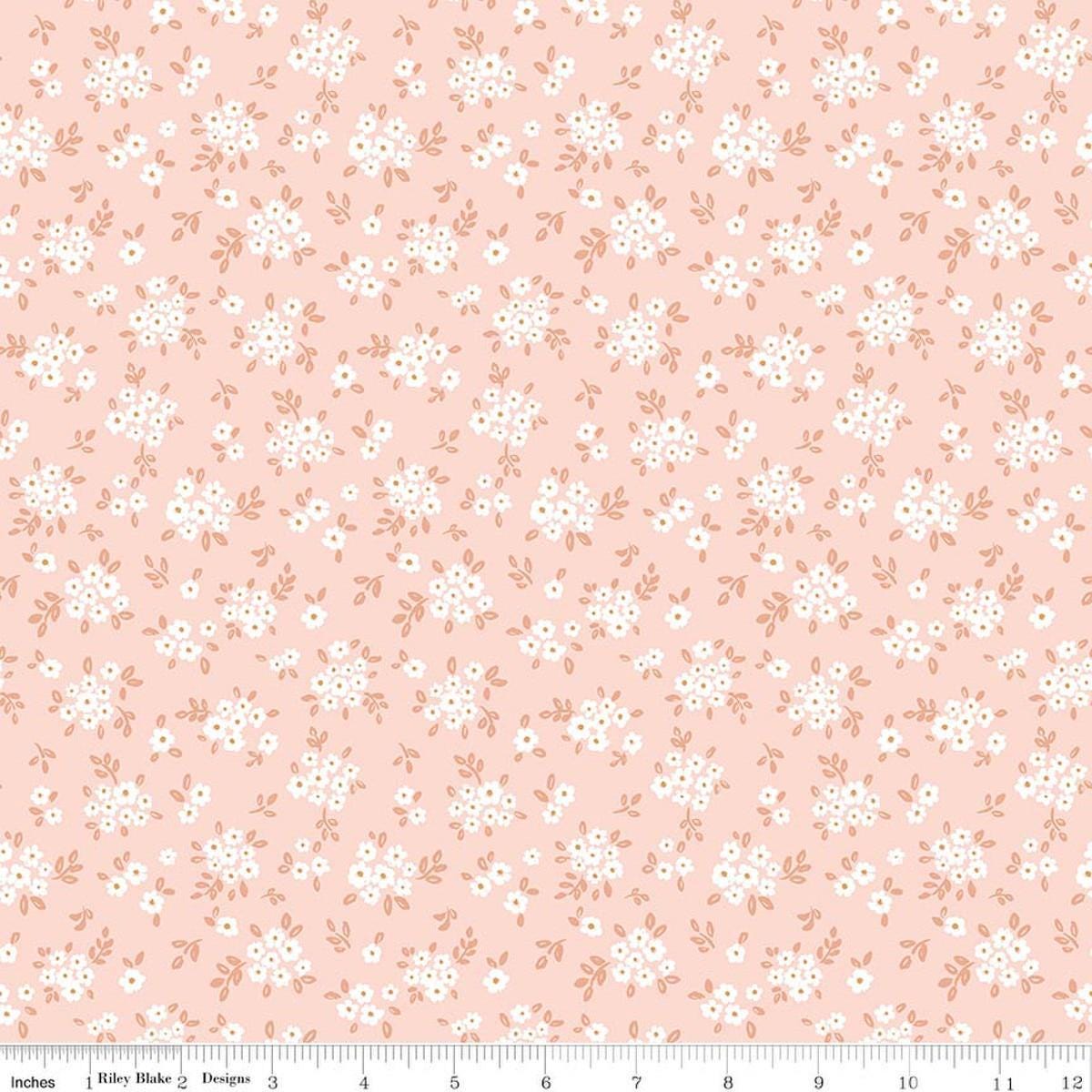 Image of Sweet Cotton Tales Blooming Bliss Shell quilting cotton fabric by Cayla Naylor for Riley Blake Designs. Features flowers on a pink background. Cute Little Fabric Shop