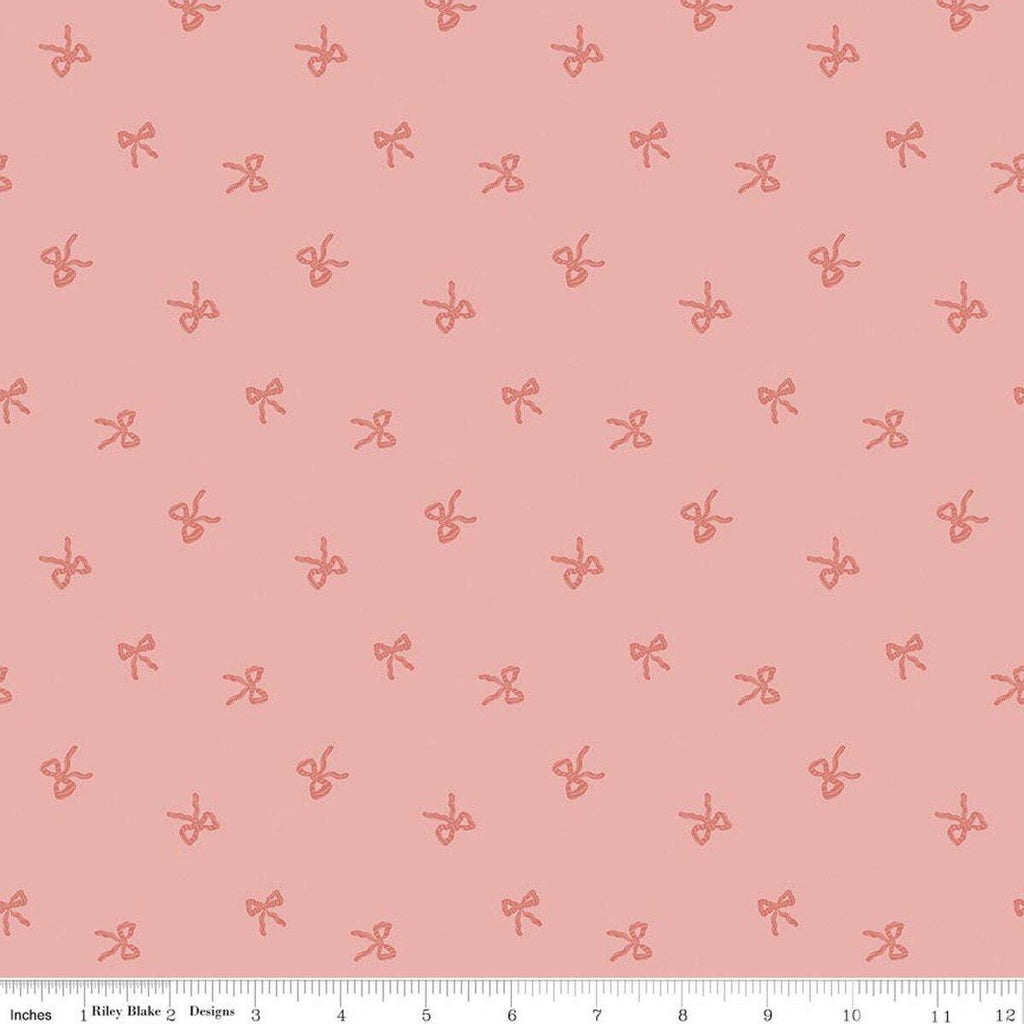 Image of Sweet Cotton Tales Twirls & Ties Rose quilting cotton fabric by Cayla Naylor for Riley Blake Designs. Features bows on a pink background. Cute Little Fabric Shop