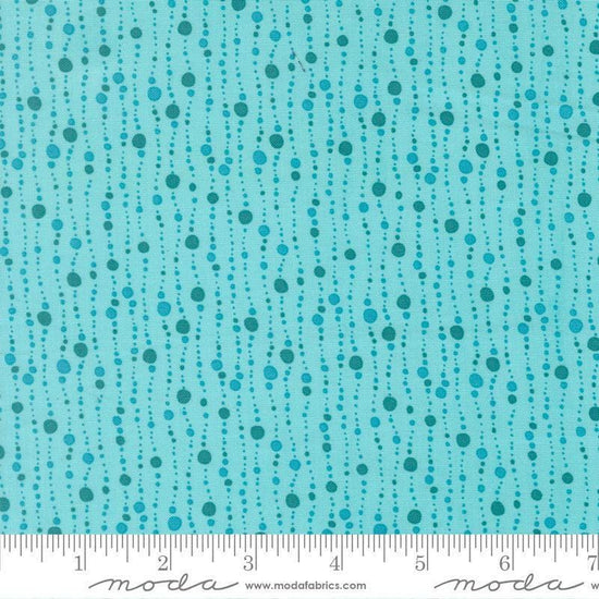 Image of Reef Bubbles Surf quilting cotton fabric by Kate Spain for Moda Fabrics. Features bubbles on a blue background. Cute Little Fabric Shop