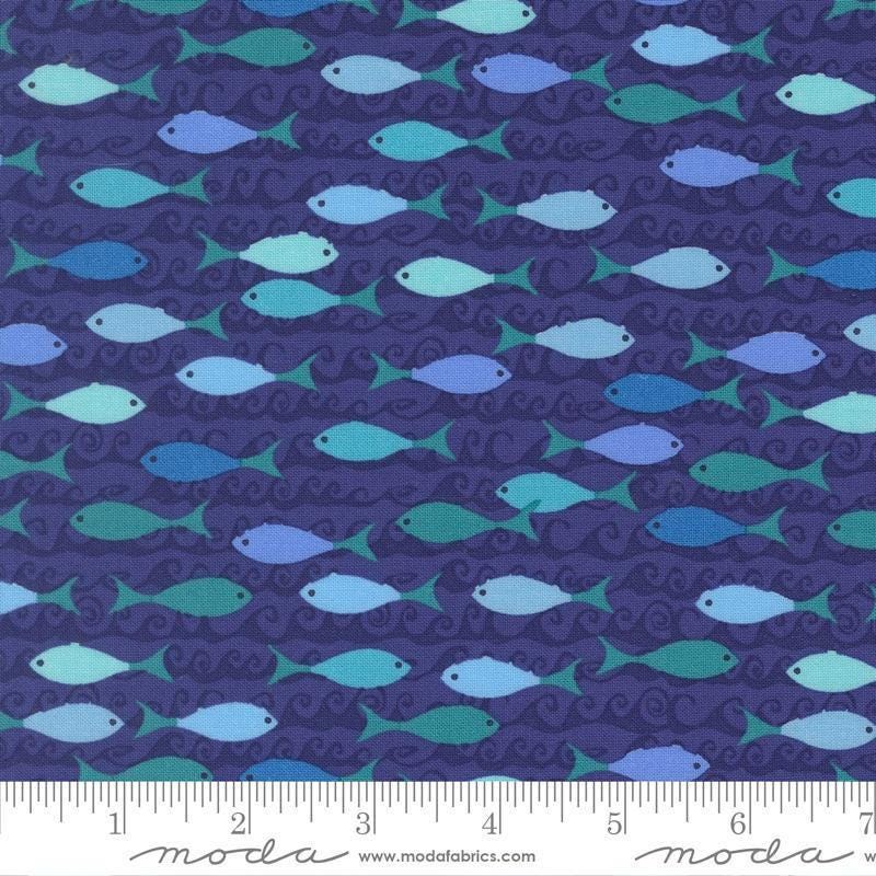 Image of Reef School of Fish Seafoam quilting cotton fabric by Kate Spain for Moda Fabrics. Features fish on a blue background. Cute Little Fabric Shop