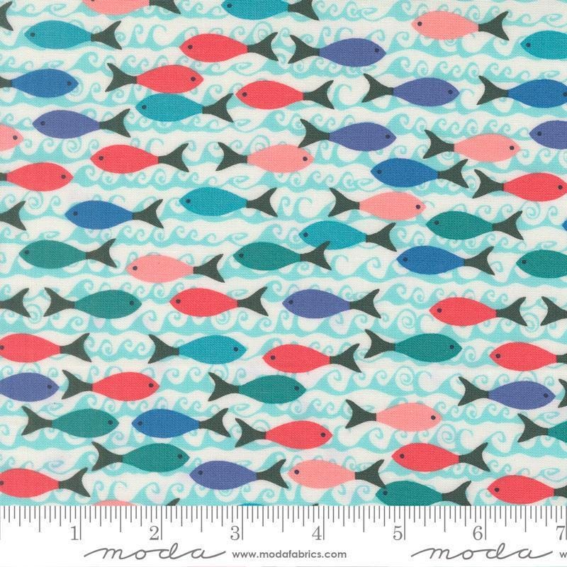 Image of Reef School of Fish Pearl quilting cotton fabric by Kate Spain for Moda Fabrics. Features fish on a blue background. Cute Little Fabric Shop