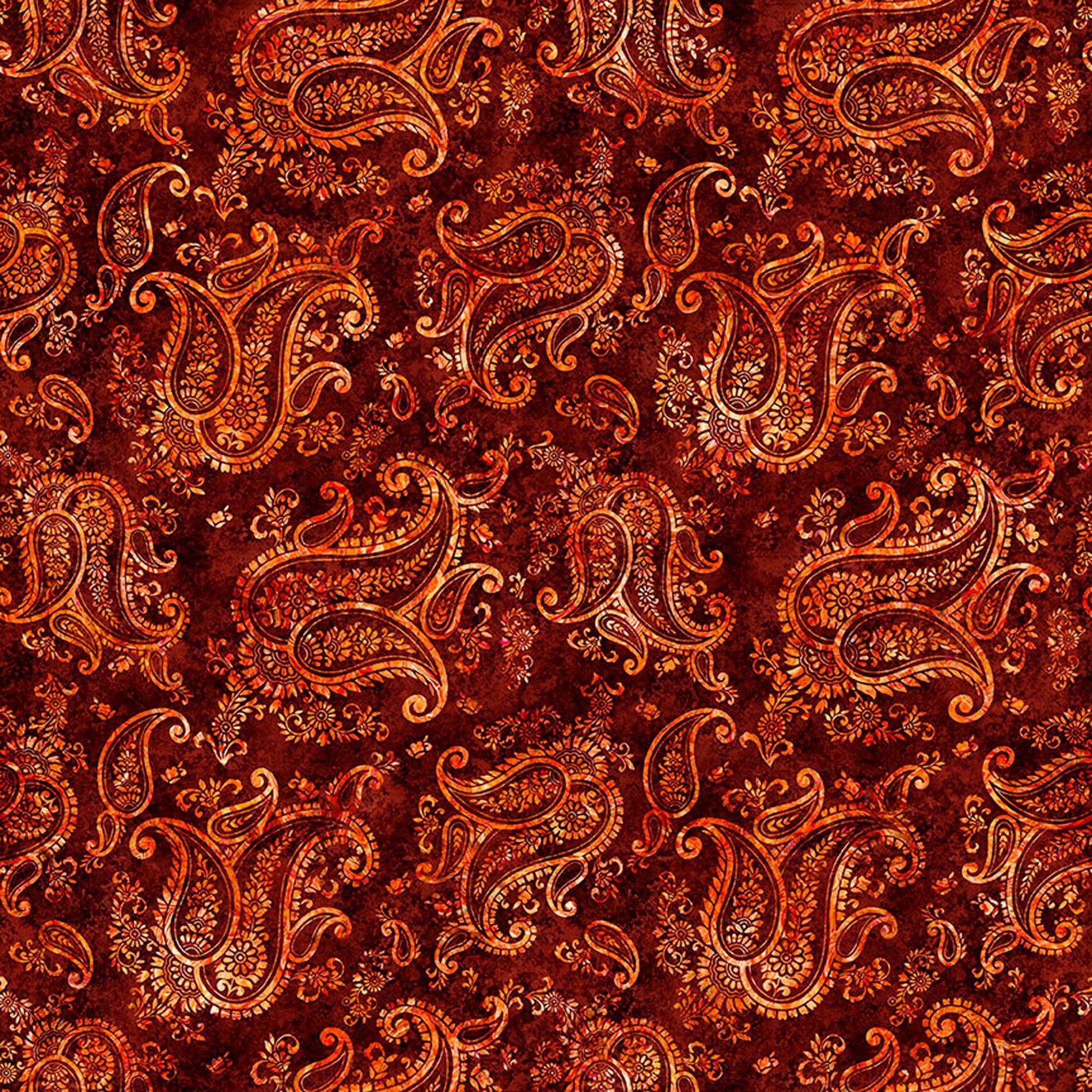 Image of Born to Run Paisley Cayenne quilting cotton fabric by Dan Morris for QT Fabrics. Features paisley on a red brown background. Cute Little Fabric Shop