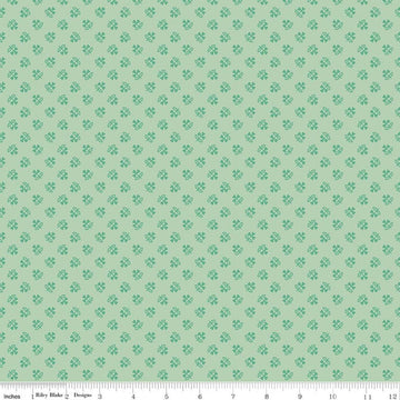 Image of Farmer's Daughter Clover Sage quilting cotton fabric by Lori Holt for Riley Blake Designs. Features plants on a green background. Cute Little Fabric Shop